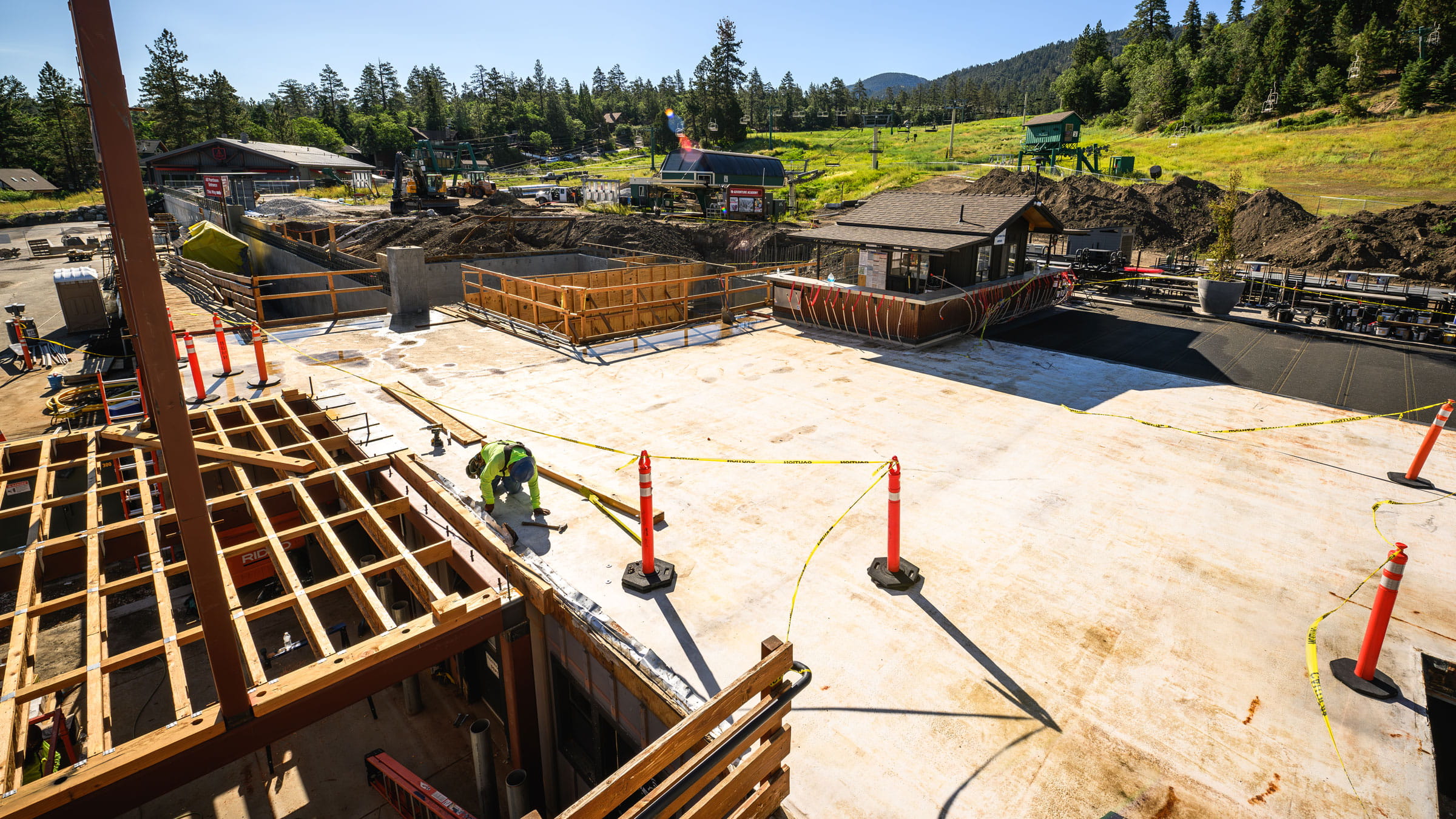 Bear Mountain sundeck expansion with wood and construction on the left side.