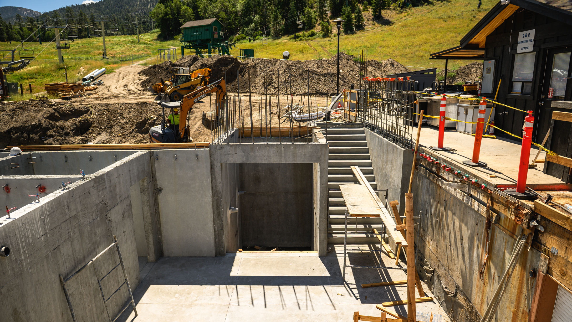 Ariel view of concrete buildings and staircase leading up to sundeck