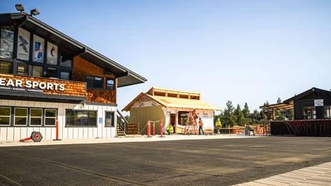 New small building being constructed to the right of Big Bear Sports retail shop.