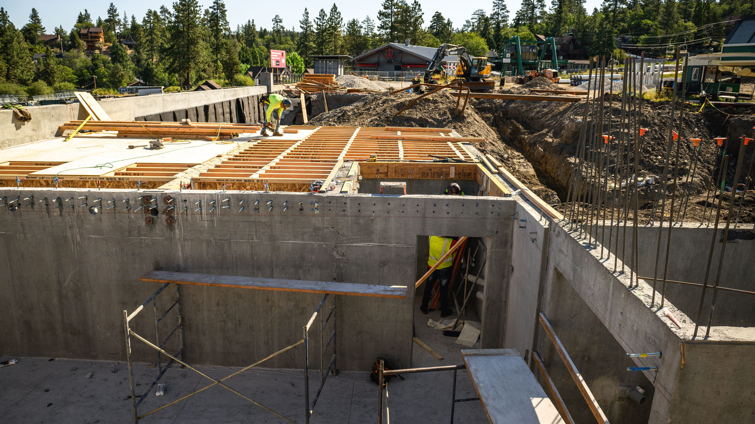 Construction zone at Ber Mountain with new concrete walls and wood decking.