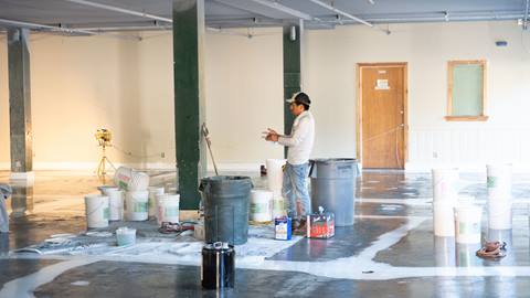 remodel inside of snow valley's rental shop construction worker standing in the middle