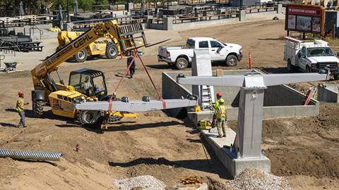 Construction workers at the base of Bear Mountain during the summer working to install the new Midway chairlift,