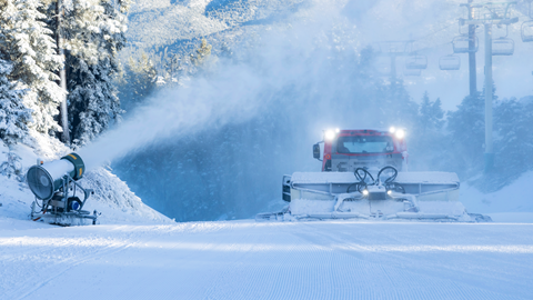 active snowmaking on a ski slope at big bear mountain resort with a snow cat