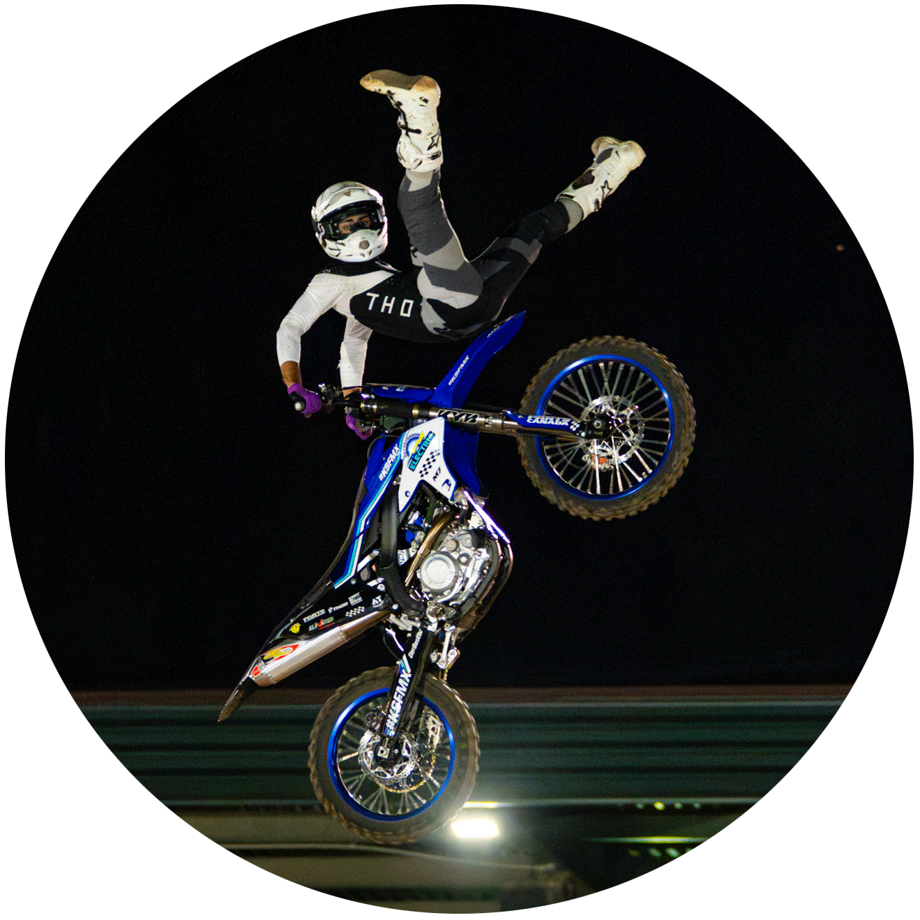 Bobby Dumahe doing a trick in the air with his motorcycle