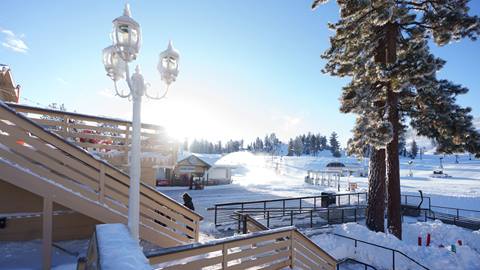 Blue bird day at Snow Valley, after a successful winter storm left fresh snowfall on the main lodge building deck and railings.