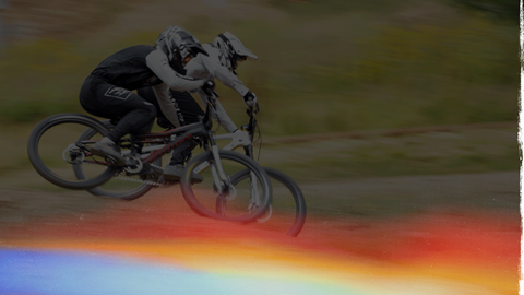 two mountain bikers going head to head in downhill race