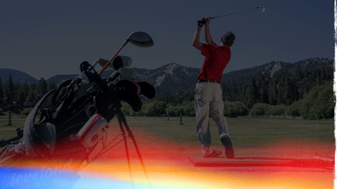 Driving Range at Bear Mountain Golf Course, golfer with red collared shirt hitting balls