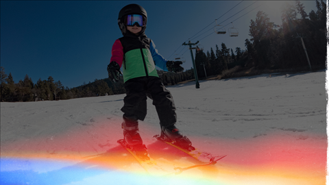 young skier going downhill