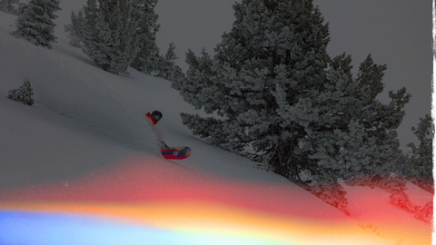 Snowboarder in fresh powder on a winter day at Big Bear Mountain Resort.