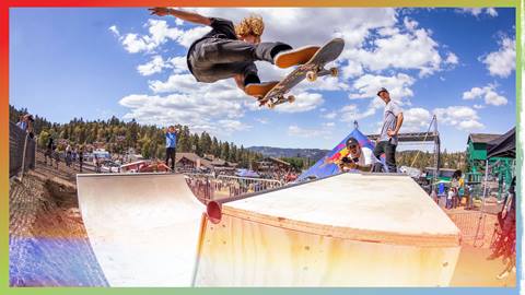 Skateboarder catching air on mini halfpipe