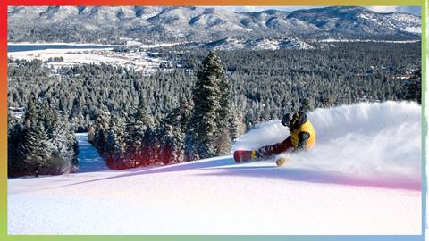 snowboarding going downhill in fresh powder