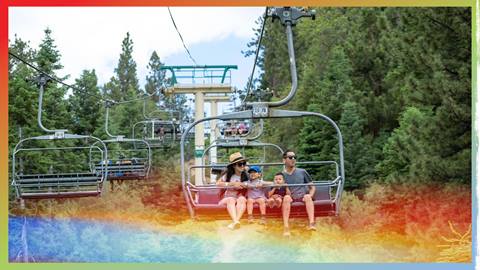 two adults and two children lift ticket holders riding the scenic sky chair