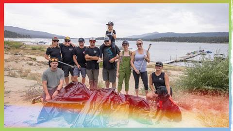 Group of adults at Big Bear Lake partaking in trash clean up