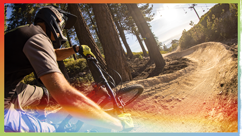 mountain biker about to turn on a dirt berm