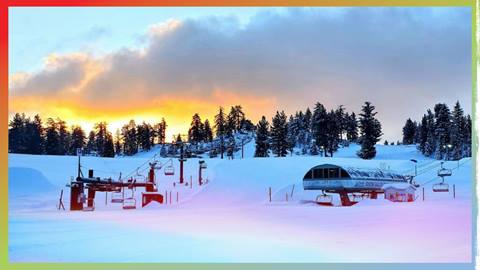 View of Snow Valley's base area and ski resort during a sunset
