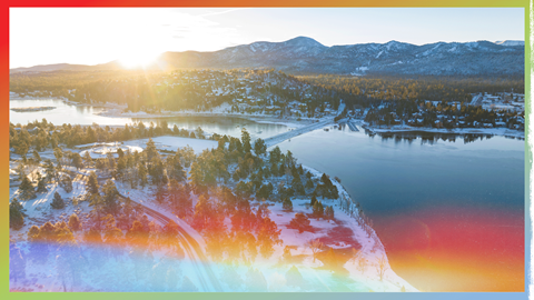 Drone view of big bear lake in the winter with a snow frosted town