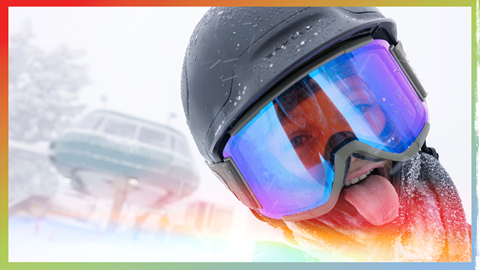 kid sticking his tongue out in snowboard gear