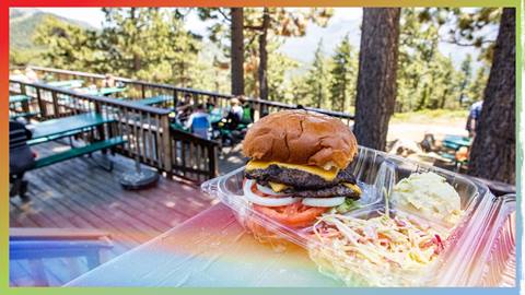 A burger, potato salad, and coleslaw on the deck at Skyline Taphouse, Snow Summit