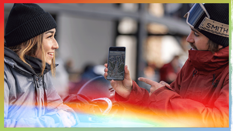 buy showing girl a mobile app with a trail map screen on it