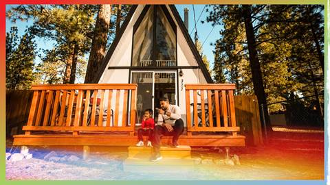 big bear lodging with dad and son sitting on the steps