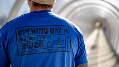 Adult wearing a Snow Valley blue 25/26 winter season opening day t-shirt.