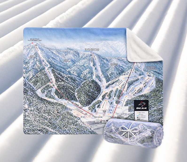 A blanket with Bear Mountain's winter trail map on one side, with an opposing blank white side.