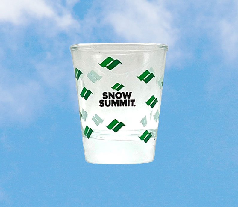 Shot glass with snow summit logo printed around it.