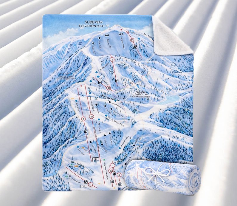 A blanket with Snow Valley's winter trail map on one side, with an opposing blank white side.