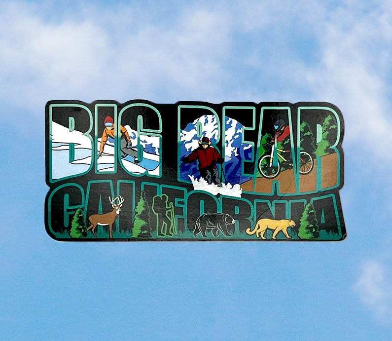 Big Bear California written on a magnet with snowboard and mountain biking activities in the letters.