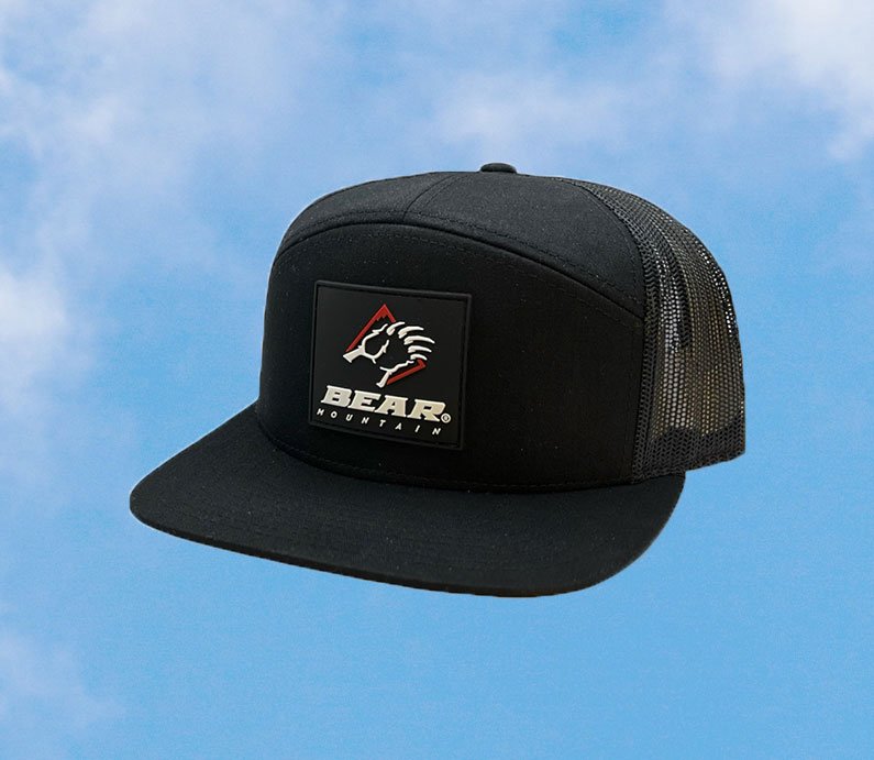 Black flat bill hat with rubber patch and Bear Mountain logo featuring a bear claw.