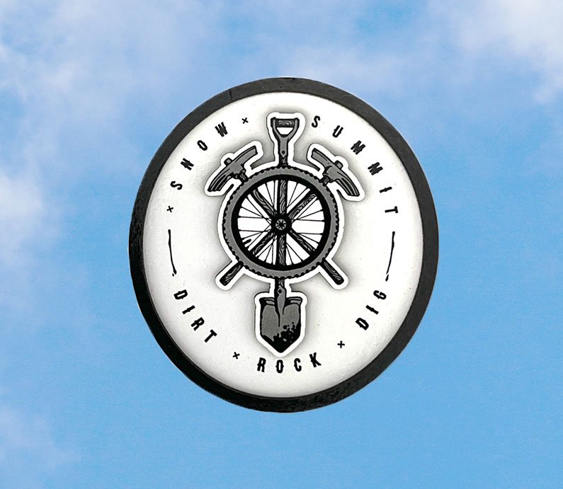 Snow summit's bike park digger logo on a magnet, black and white.