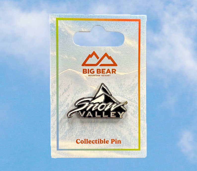 Collectible Snow Valley logo pin in black and white.