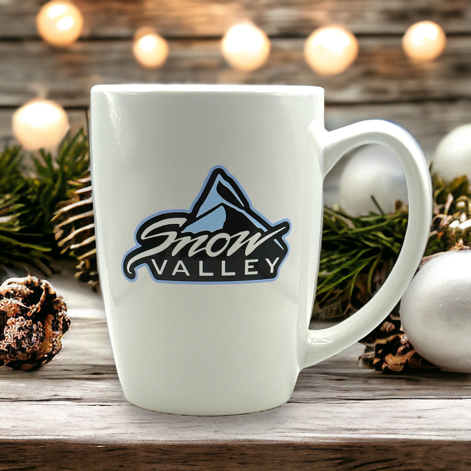 Ceramic white Mug with blue, white, black Snow Valley Logo with mountain peak design