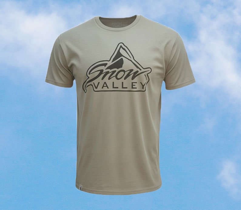 Grey t shirt with dark colored snow valley logo in center of shirt.