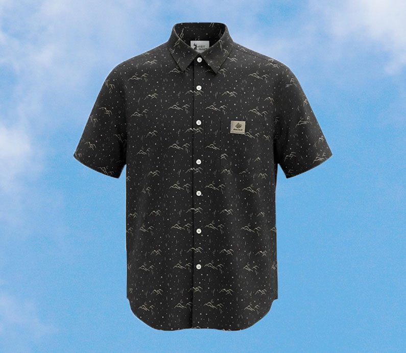 Black short sleeve button up shirt with mountain and moon design with a Bear Mountain clip label on front pocket.