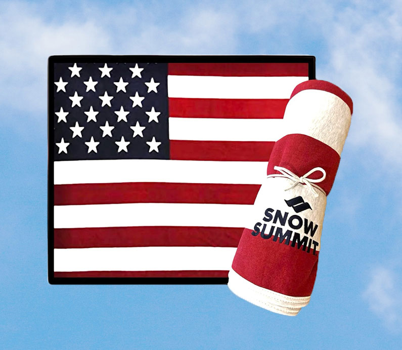 Snow summit logo on red, white, and blue flagged blanket.