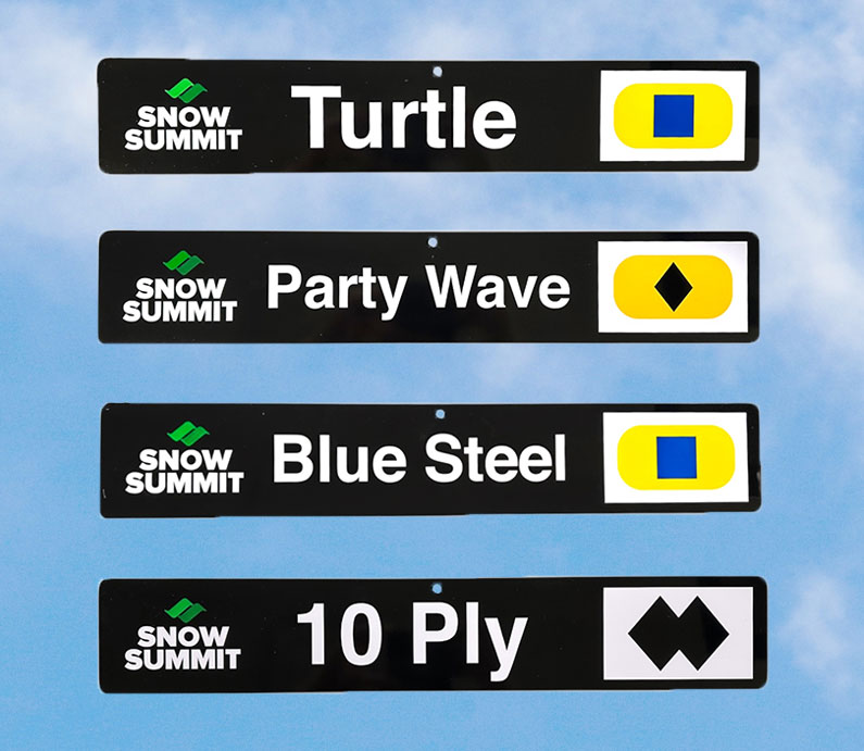 Black trail signs with Snow Summit summer runs: Turtle, Party Wave, Blue Steel, 10 Ply.