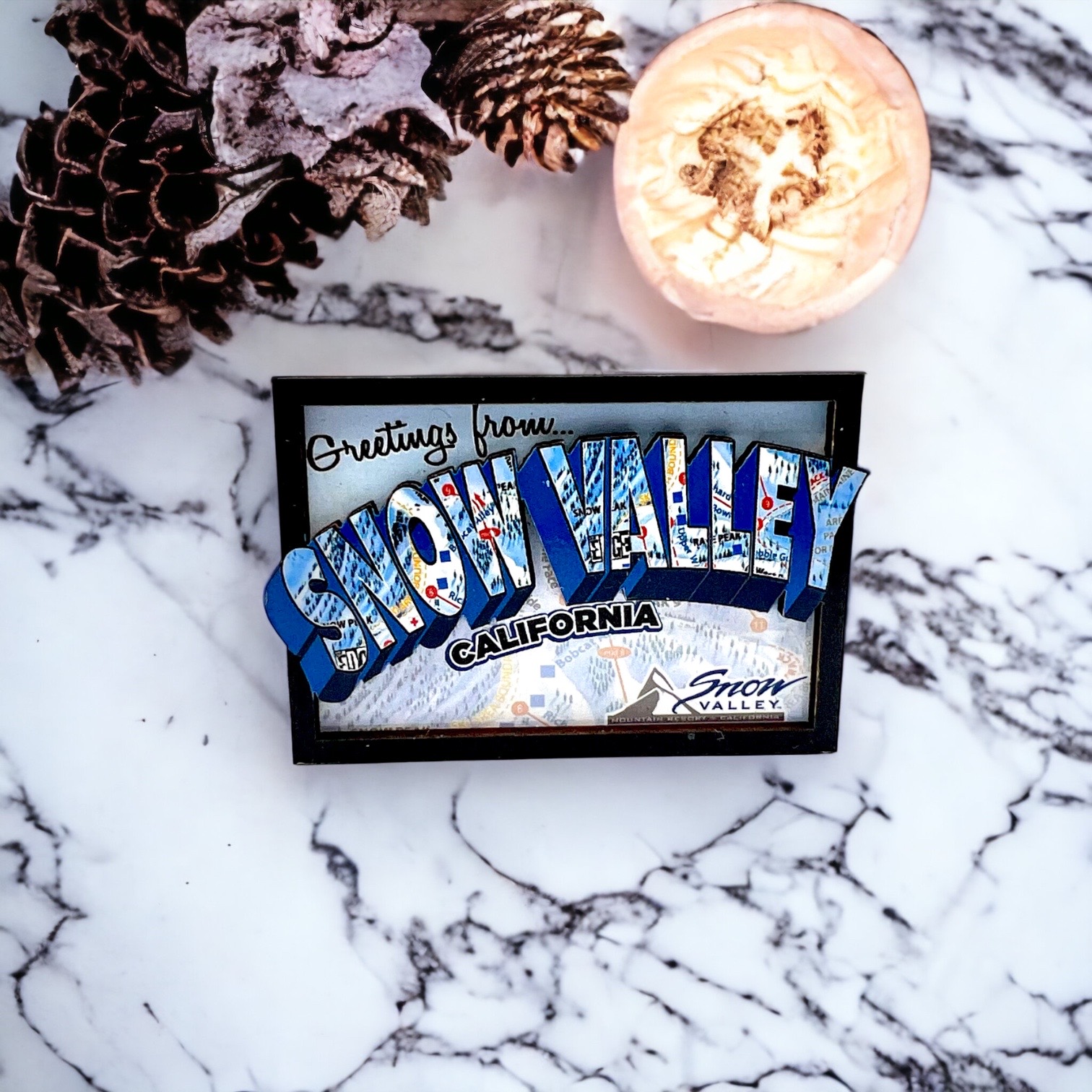 Black, blue, and white Greetings from Snow Valley CA magnet