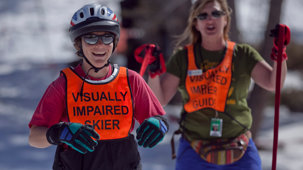 USARC program with our visually impaired skier and their guide behind them