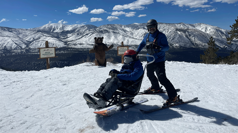 Two skiers at the top of chair 9 at Bear Mountain, ADA skier program