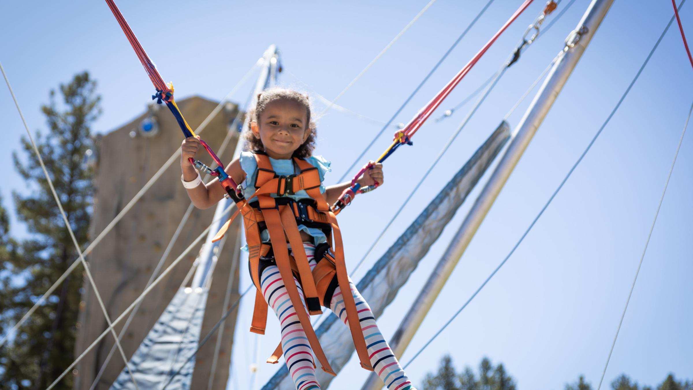 Little girl jumping on a euro bungee trampoline