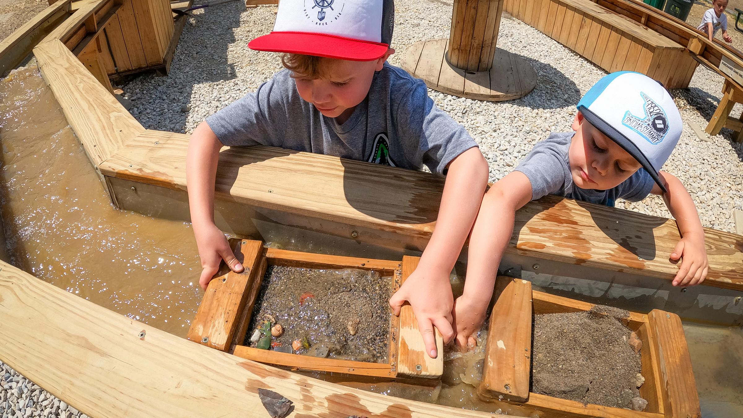 Two kids mining for gems at Summit Mining Co.