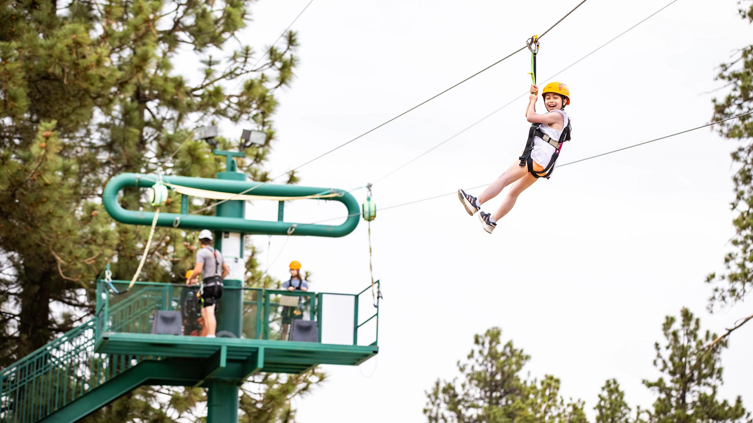 Girl zip lining.