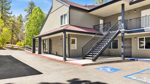 Main entrance to the employee housing facility with a handicap parking spot at the front.