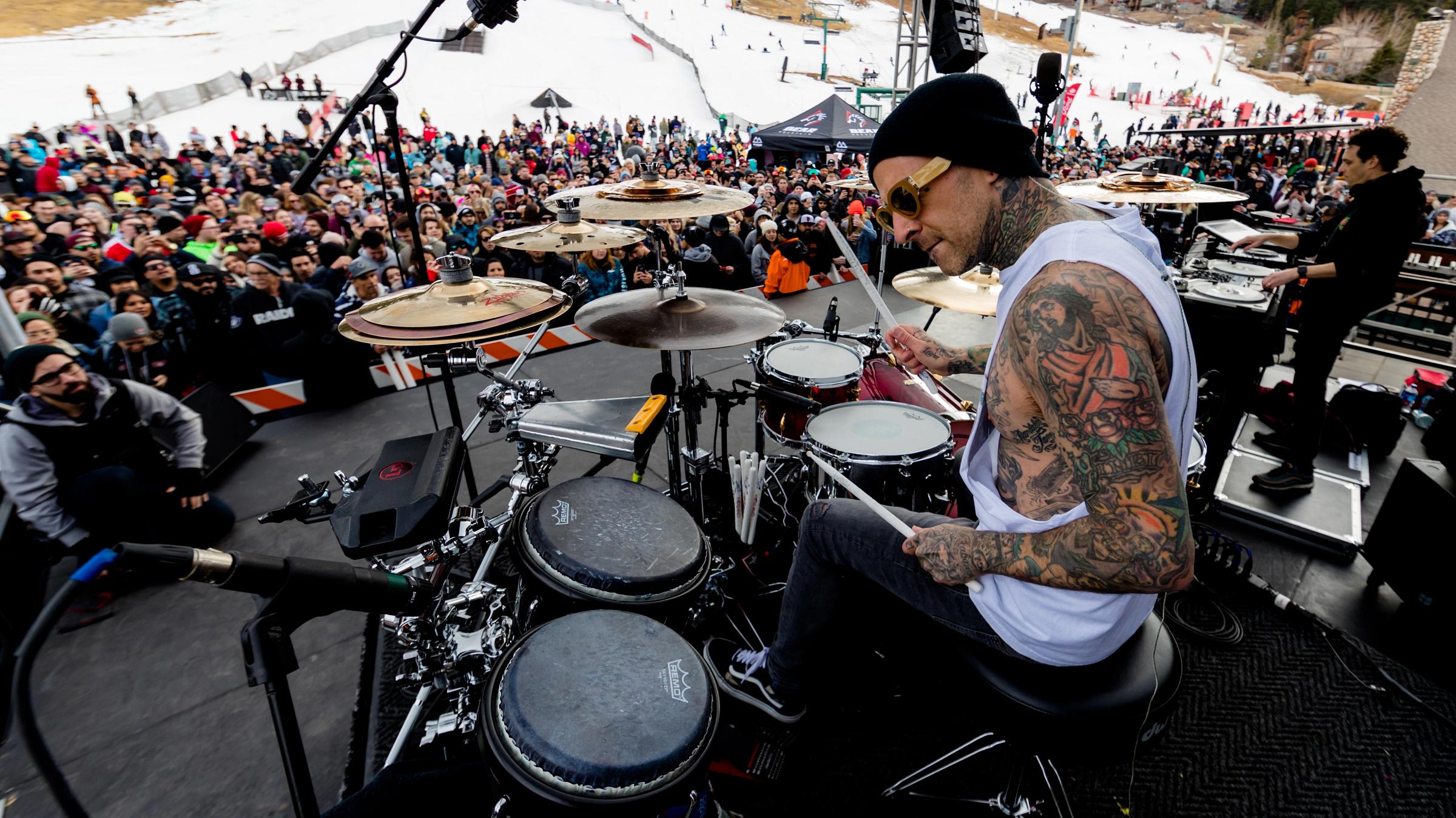 Travis Barker playing the drums at bear mountain
