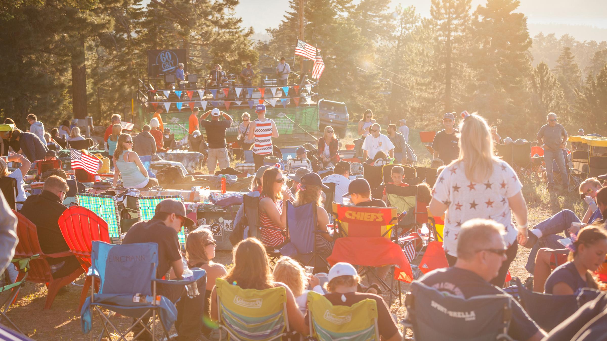 Crowd sitting in lawn chairs