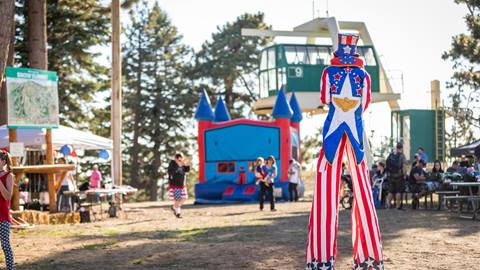 Stilt walker wearing patriot colors