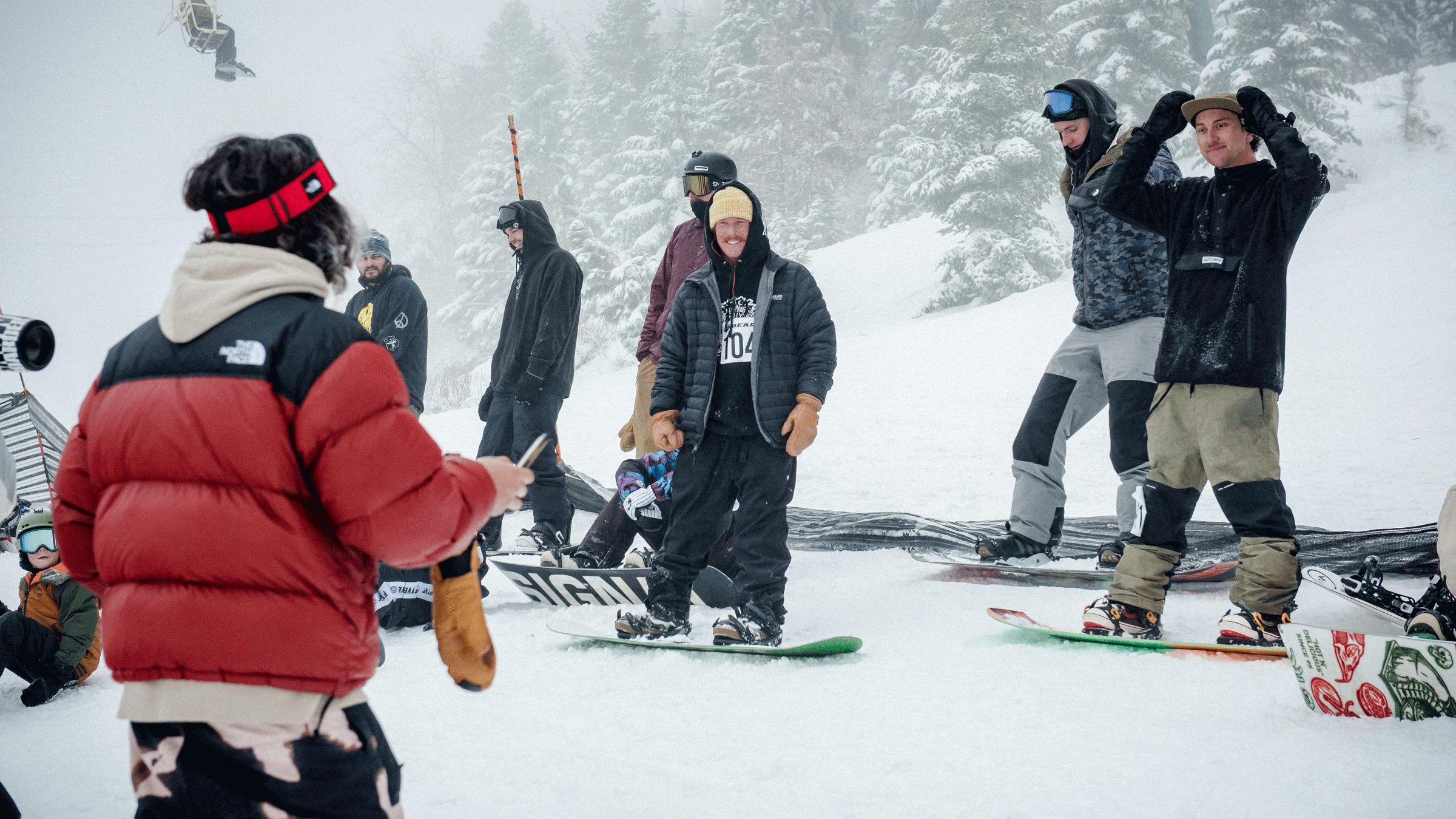 Group of snowboarders on the snowy mountain