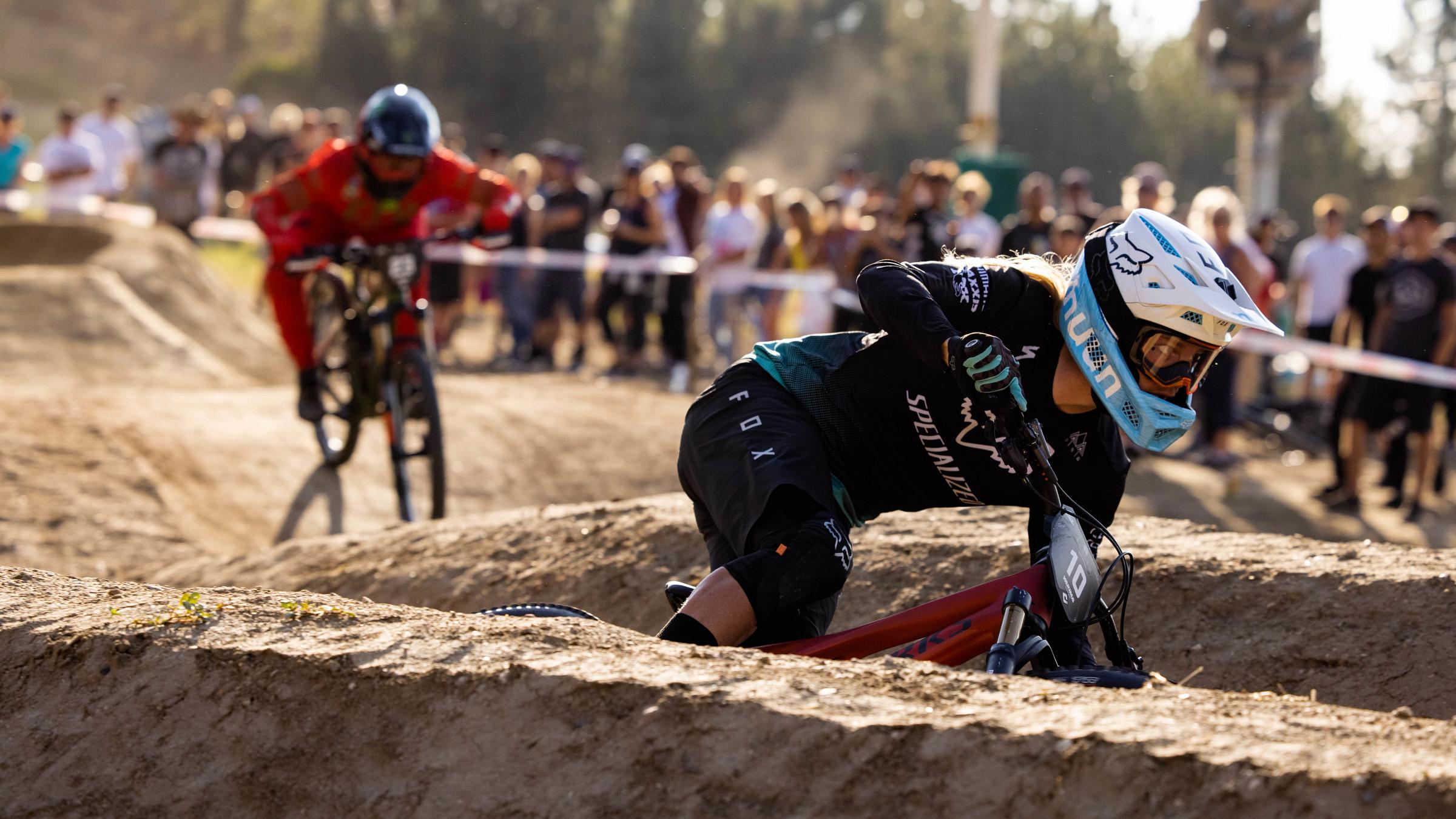 Two mountain bikers racing in a dual slalom course