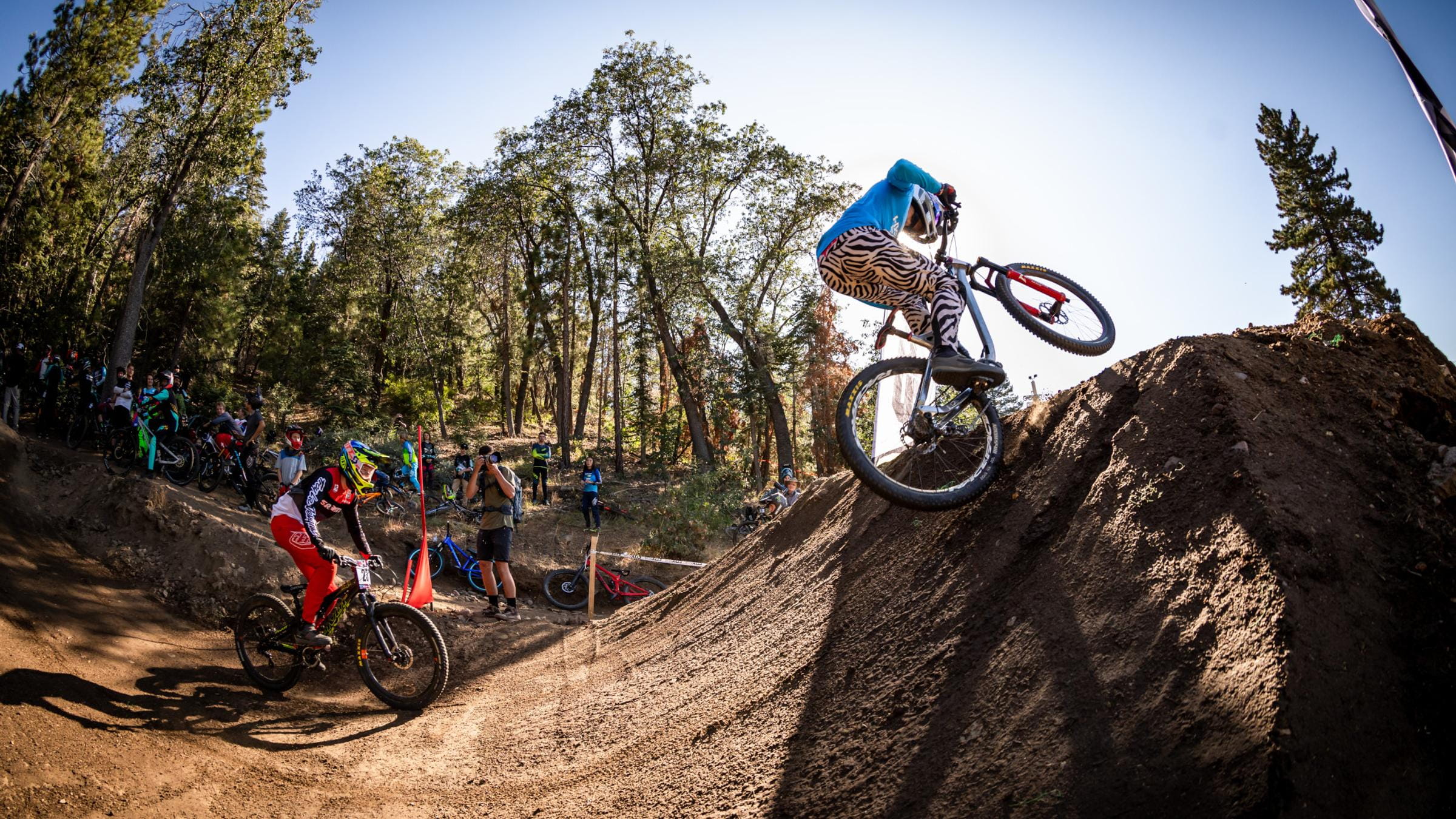 Two mountain bikers racing.